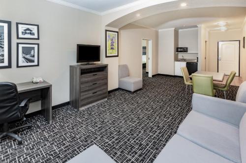 an office with a desk and a television and a room at La Quinta by Wyndham Garland Harbor Point in Garland