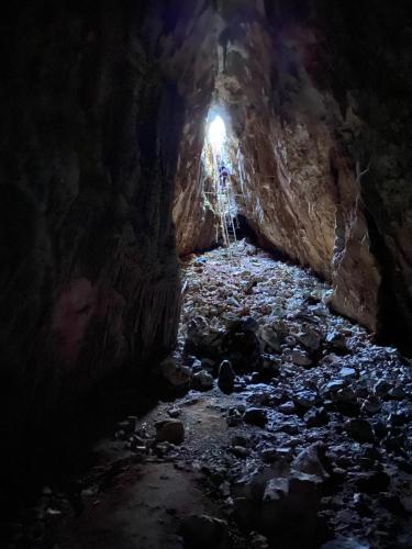 a cave with a light at the end of it at Casa M&M in Cala Gonone