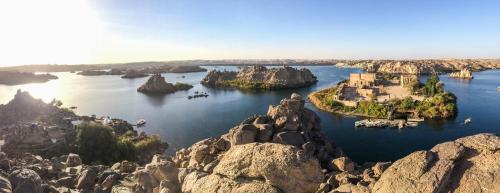 an island in the middle of a river with rocks at Eco Nubia in Aswan