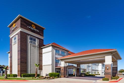 a front view of a hotel with a gazebo at La Quinta by Wyndham Garland Harbor Point in Garland