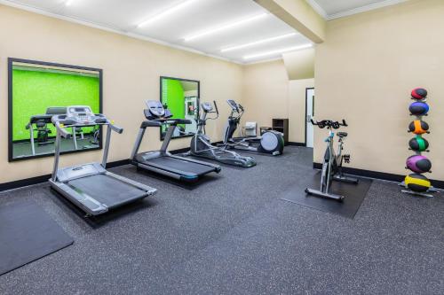 a fitness room with treadmills and exercise machines at La Quinta by Wyndham Garland Harbor Point in Garland