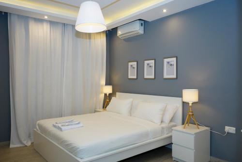 Ένα ή περισσότερα κρεβάτια σε δωμάτιο στο Elite Corner Apartment