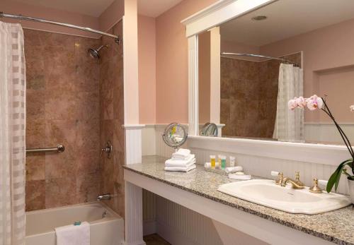 a bathroom with a sink and a shower at Lord Camden Inn in Camden
