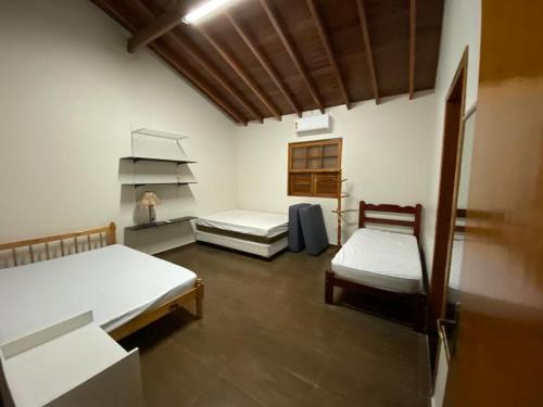 Tempat tidur dalam kamar di Chácara Klein