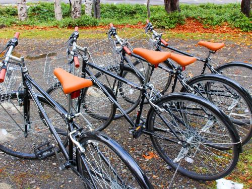 a group of bikes parked next to each other at Sounkyo Hostel in Kamikawa