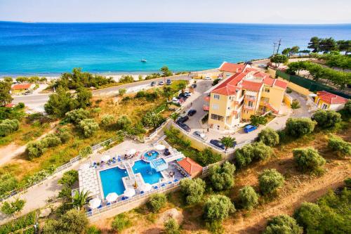an aerial view of a house and the ocean at Hotel Diamond in Limenaria