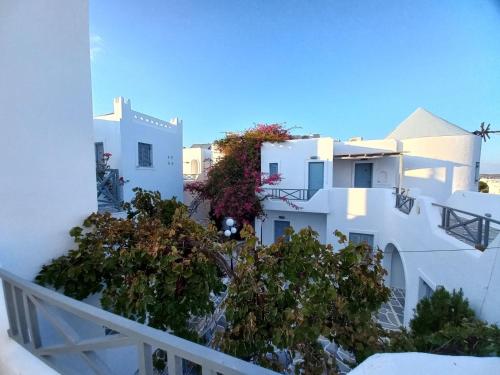 a view from the balcony of a white building at Teoria Paros - Matsas Windmill in Naousa
