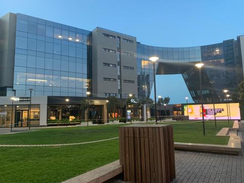 a large building with a park in front of it at Umhlanga Arch 703 Sea View self-catering in Durban