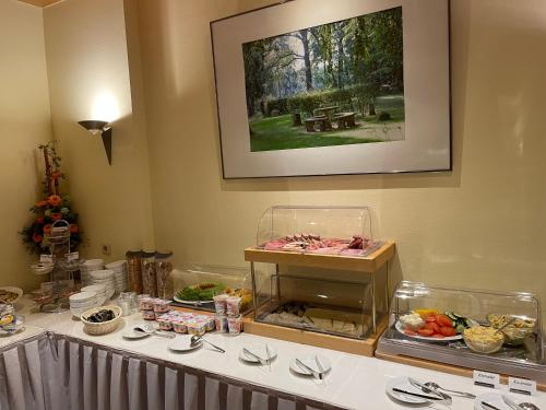 a buffet line with food on a table at Hotel Luther Birke Wittenberg in Lutherstadt Wittenberg