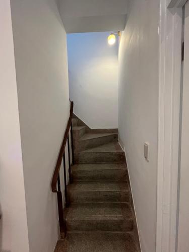 a staircase in a building with a stair case at Rolling Pin Homestay in Tainan