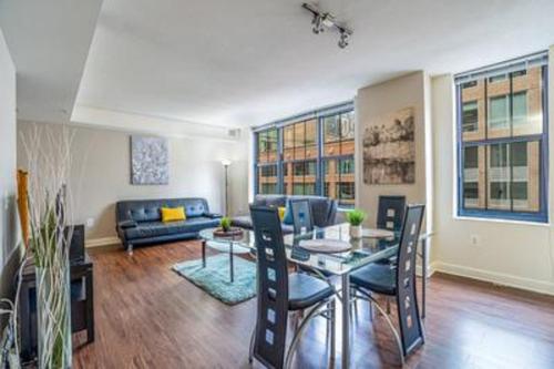 a living room with a table and a couch at Waterfront Baltimore 2BR Furnished Apartment apts in Baltimore
