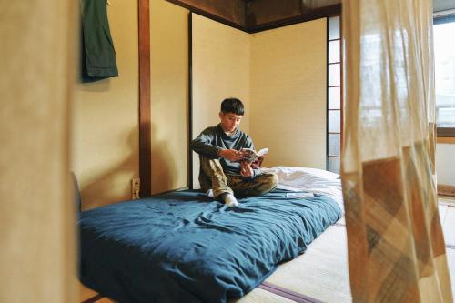 Katil atau katil-katil dalam bilik di Gojo Guest House