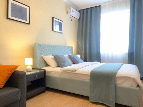 Posteľ alebo postele v izbe v ubytovaní Вид на стадион Краснодар