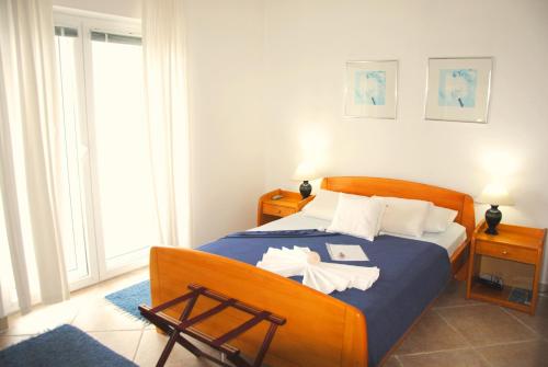 Кровать или кровати в номере Apartments Villa Kukoljac