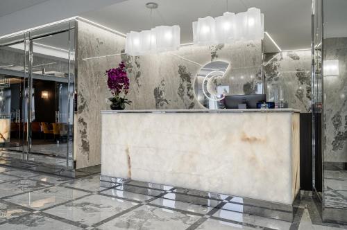 a lobby with a reception desk in a building at Congress Hotel in Vilnius