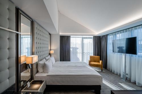 מיטה או מיטות בחדר ב-Hotel Congress