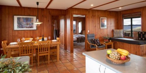 a kitchen and living room with a table and chairs at Turon Gates - Mountain Retreat in Capertee