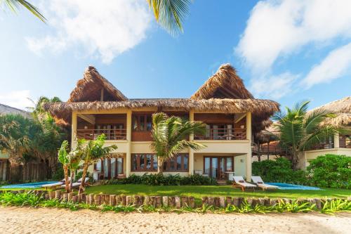 a villa on the beach with palm trees at Zoetry Agua Punta Cana - All Inclusive in Punta Cana