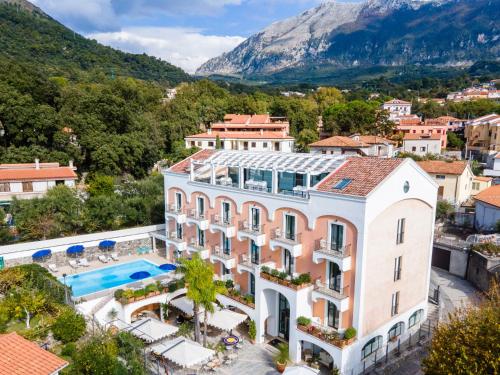 an aerial view of a building with a swimming pool at Hotel Murmann in Maratea