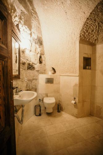 a bathroom with a sink and a toilet at Village Cave House Hotel in Goreme