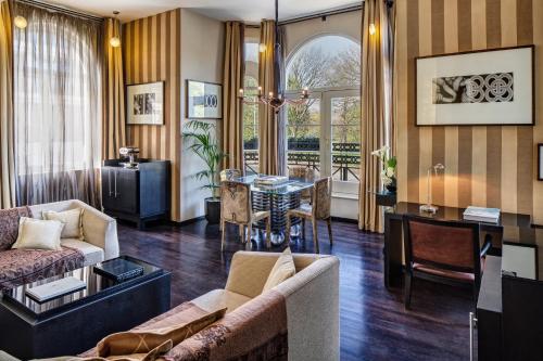 a living room with a couch and a table at Baglioni Hotel London - The Leading Hotels of the World in London