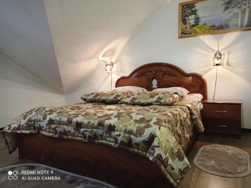 Ένα ή περισσότερα κρεβάτια σε δωμάτιο στο Славутич