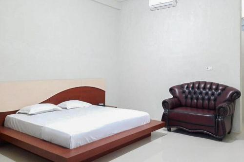 Säng eller sängar i ett rum på Hayori Hotel RedPartner