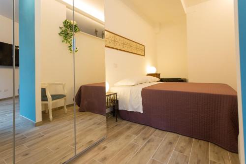 Кровать или кровати в номере casa luna al pigneto