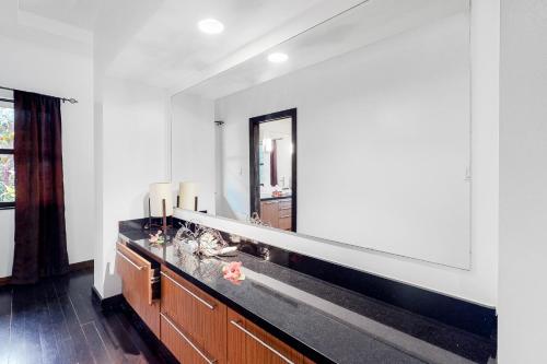 a bathroom with a large mirror on the wall at Legion at Morningstar Breeze Gold Standard Certified in Hopkins
