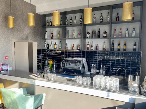 a bar with a lot of bottles of alcohol at Terrasse Hotel & Bar in Bishkek