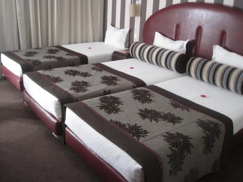 Katil atau katil-katil dalam bilik di Hotel As Americas