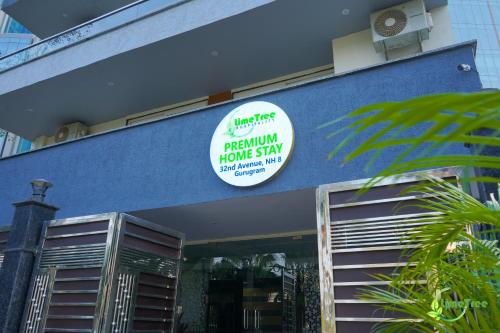a sign on the side of a building at Lime Tree Hotel Near 32nd Avenue Sector 29 Gurgaon in Gurgaon