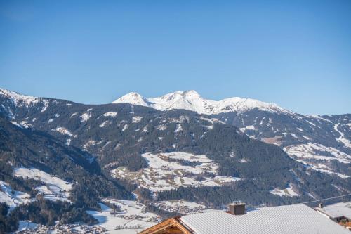 a view of a mountain with snow covered mountains at Ferienwohnung Zillertalblick in Stummerberg