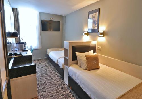 Cama o camas de una habitación en XO Hotels City Centre
