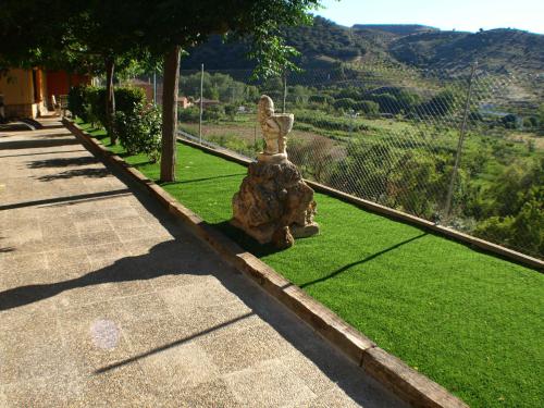 a statue of a rabbit sitting on the grass at Suite Rural Carenas in Carenas