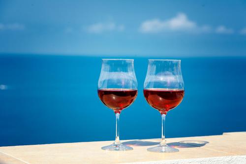 two glasses of red wine sitting on a table at B&B La Terrazza in Cetraro