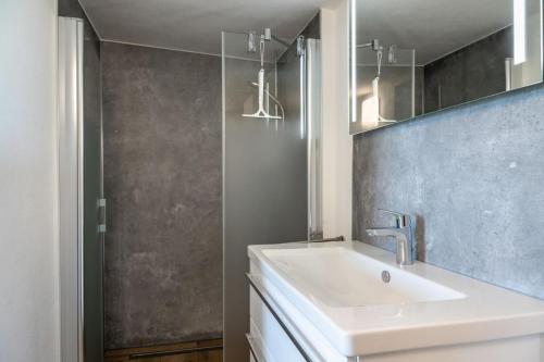 a bathroom with a sink and a mirror at Haus am Hügel in Groß Zicker