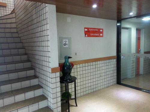 a vase sitting on a stool in a hallway at Inter Hotel in Recife