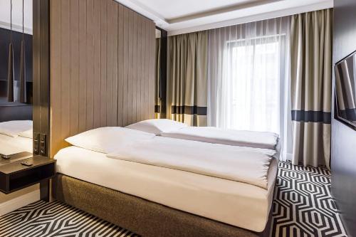 Posteľ alebo postele v izbe v ubytovaní VacationClub – Baltic Park Fort Apartament F.210