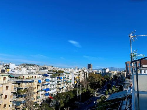 a view of a city with tall buildings at Athens Skylight Condo in Athens