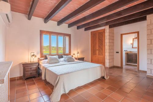 a bedroom with a large bed in a room at Es turo de ses illes in Ses Salines