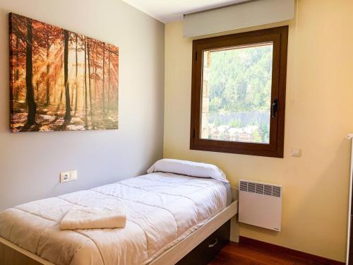 En eller flere senge i et værelse på Apartamento moderno Pic negre con vistas