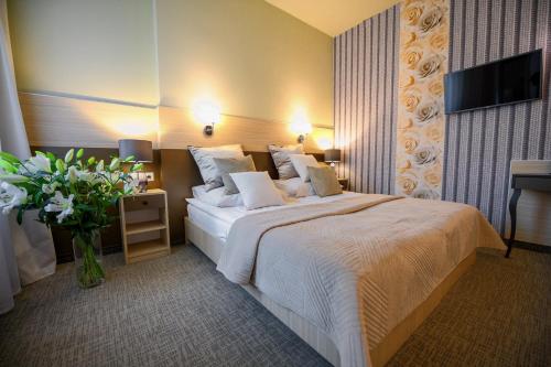 Posteľ alebo postele v izbe v ubytovaní Hotel Kazimierz III