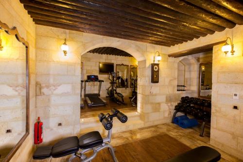 a room with a gym with a bike in it at Kayakapi Premium Caves Cappadocia in Urgup
