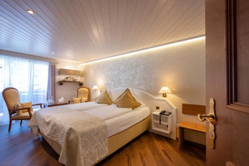 Llit o llits en una habitació de Seilers Vintage Hotel & Spa