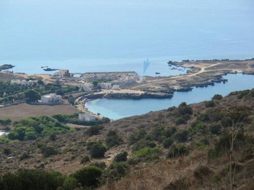 a view of a river from a hill at Il Cubo, monovano col mare su tre fronti. in Favignana