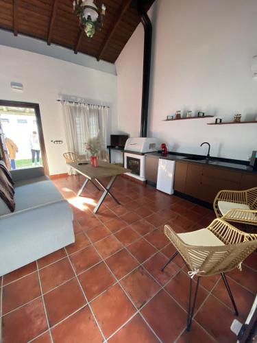 a kitchen with a table and chairs in a room at CASA KIKA ROCIO in El Rocío