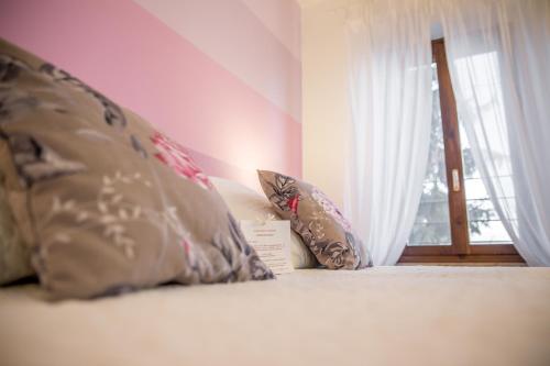 Ένα ή περισσότερα κρεβάτια σε δωμάτιο στο Agriturismo e Agricamping Le Nosare
