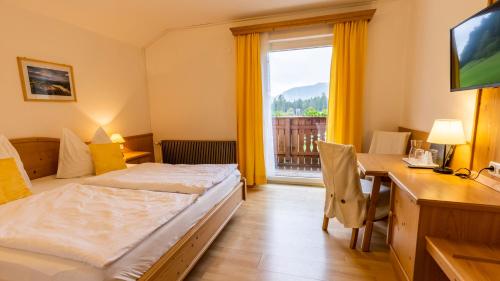 Posteľ alebo postele v izbe v ubytovaní Alpenhotel Ensmann