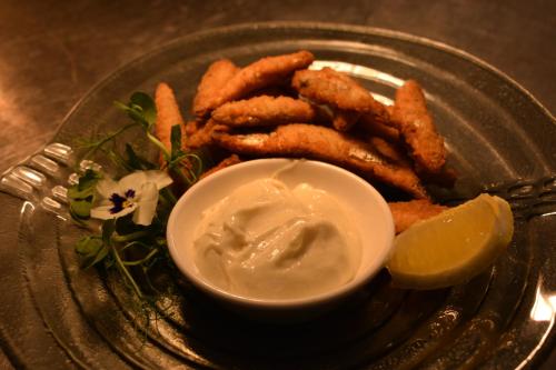 a plate of food with french fries and dipping sauce at Crug Glas Country House in St. Davids